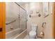 Bathroom featuring a shower/tub combo and classic-style wallpaper at 2416 Se 15Th St, Ocala, FL 34471