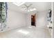Bright bedroom with skylights, light-colored walls, and a patterned carpet provides a serene and airy atmosphere at 2416 Se 15Th St, Ocala, FL 34471