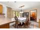 Kitchen flows into the formal dining area with natural light coming in at 2416 Se 15Th St, Ocala, FL 34471