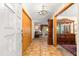 Welcoming foyer with tile flooring, elegant chandelier, and view of the living area at 2416 Se 15Th St, Ocala, FL 34471