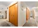 Hallway featuring a coat closet and carpeted floors at 2416 Se 15Th St, Ocala, FL 34471