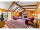 Inviting living room with exposed wood beams, fireplace, built-in shelves and lots of natural light at 2416 Se 15Th St, Ocala, FL 34471