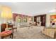 Cozy living room with built-in bookcase, soft lighting, and classic furniture arrangement at 2416 Se 15Th St, Ocala, FL 34471