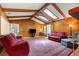 Cozy living room with wood paneling, skylights, comfortable seating, and area rug at 2416 Se 15Th St, Ocala, FL 34471