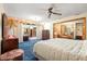Large main bedroom offers ample space, blue carpet, and a comfortable layout leading to an outdoor living space at 2416 Se 15Th St, Ocala, FL 34471