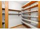 Walk-in pantry featuring open shelving at 2416 Se 15Th St, Ocala, FL 34471
