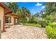 Cozy brick patio perfect for outdoor dining and relaxation with lush green surroundings at 2416 Se 15Th St, Ocala, FL 34471