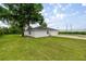 Expansive backyard with lush green grass surrounding the home at 2521 Nw 45Th Pl, Ocala, FL 34475