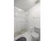 Clean bathroom featuring glass door shower and a toilet with tiled floors at 2521 Nw 45Th Pl, Ocala, FL 34475