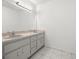 Bathroom featuring large double vanity, ample cabinet space and a large mirror at 2521 Nw 45Th Pl, Ocala, FL 34475