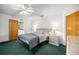 Bright bedroom features a ceiling fan, large bed, neutral color palette, and lots of natural light at 2521 Nw 45Th Pl, Ocala, FL 34475