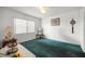 Comfortable bedroom featuring plush carpeting, ample natural light, and neutral tones for a serene retreat at 2521 Nw 45Th Pl, Ocala, FL 34475