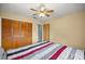 Comfortable bedroom featuring a closet, door, and carpeted floors at 2521 Nw 45Th Pl, Ocala, FL 34475