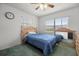 Cozy bedroom with natural light, a spacious window, and green carpet at 2521 Nw 45Th Pl, Ocala, FL 34475