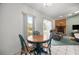 Dining area by windows with natural light, adjacent to the kitchen and living room at 2521 Nw 45Th Pl, Ocala, FL 34475