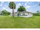 Charming single-story home with a vibrant green lawn and mature trees at 2521 Nw 45Th Pl, Ocala, FL 34475
