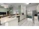 Bright kitchen featuring white cabinetry, counter space, tile flooring, and an open design at 2521 Nw 45Th Pl, Ocala, FL 34475