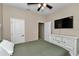 Bedroom with wood-look flooring, ceiling fan, and a television at 2525 Sw 7Th Ave, Ocala, FL 34471