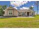 Charming single-story home with stone accents, manicured lawn, and inviting curb appeal under a bright sky at 2525 Sw 7Th Ave, Ocala, FL 34471