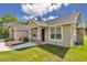 Inviting home exterior featuring a covered entryway, stone accents and well-kept landscaping at 2525 Sw 7Th Ave, Ocala, FL 34471