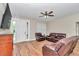 Inviting living room with natural light, wood-look tile flooring, and comfortable seating, perfect for relaxation at 2525 Sw 7Th Ave, Ocala, FL 34471