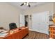 Office featuring wood-look tile flooring, a ceiling fan, and a closet at 2525 Sw 7Th Ave, Ocala, FL 34471