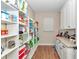 Walk-in pantry with granite countertops and open shelving for ample storage at 2525 Sw 7Th Ave, Ocala, FL 34471