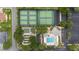 Aerial view of community amenities, featuring tennis courts, shuffleboard, pool and clubhouse, offering residents an active lifestyle at 2608 Casso Ct, The Villages, FL 32162