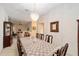 Formal dining room with chandelier at 2608 Casso Ct, The Villages, FL 32162