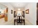 Long formal dining room with chandelier at 2608 Casso Ct, The Villages, FL 32162