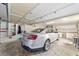This two-car garage provides ample space for vehicles and features a storage area with cabinets for organization at 2608 Casso Ct, The Villages, FL 32162