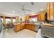 Eat-in kitchen features stainless appliances, breakfast bar and dining area at 2608 Casso Ct, The Villages, FL 32162