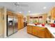 Bright eat-in kitchen features stainless steel appliances and white countertops at 2608 Casso Ct, The Villages, FL 32162