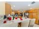 Eat-in kitchen features stainless appliances, tile backsplash and breakfast bar at 2608 Casso Ct, The Villages, FL 32162