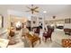 Spacious living room features a ceiling fan, neutral walls, and comfortable seating at 2608 Casso Ct, The Villages, FL 32162