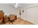 Dedicated home office space with wood laminate floors, ample storage, and a comfortable workspace at 2608 Casso Ct, The Villages, FL 32162