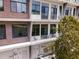 Condo balconies with sliding glass doors, metal railings, and brick accents, offering great views and outdoor space at 302 Se Broadway St # 240, Ocala, FL 34471