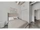 Comfortable bedroom featuring a well-lit interior, neutral colors, and minimalist design elements at 302 Se Broadway St # 240, Ocala, FL 34471