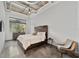 Comfortable bedroom with concrete floors and a bright window with a peaceful view at 302 Se Broadway St # 240, Ocala, FL 34471