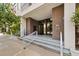 Inviting exterior of building featuring steps, glass doors, and brick accents, providing a welcoming entrance at 302 Se Broadway St # 240, Ocala, FL 34471