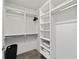 Walk-in closet featuring built-in shelving, and concrete floors at 302 Se Broadway St # 240, Ocala, FL 34471