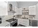 Stylish kitchen features stainless steel appliances, sleek cabinetry, and contemporary backsplash, offering a modern culinary experience at 302 Se Broadway St # 240, Ocala, FL 34471