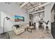 Spacious open-concept living room showcasing concrete floors and a modern kitchen at 302 Se Broadway St # 240, Ocala, FL 34471