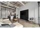 Inviting open-concept living room with concrete floors and adjacent modern kitchen at 302 Se Broadway St # 240, Ocala, FL 34471
