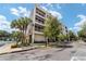 Modern condo building with a minimalist design, featuring private balconies, landscaping, and street access at 302 Se Broadway St # 240, Ocala, FL 34471