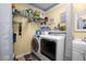 The laundry room features a front loading washer/dryer and storage at 3299 County Road 521, Wildwood, FL 34785