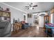 Cozy room features a rustic wood accent table, comfortable seating, barn doors and stylish decor at 3299 County Road 521, Wildwood, FL 34785
