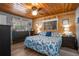 This main bedroom offers a wood plank ceiling, light gray walls, and a quaint window display shelf at 3299 County Road 521, Wildwood, FL 34785