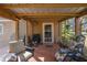 Relaxing screened porch with ceiling fan and outdoor furniture at 3299 County Road 521, Wildwood, FL 34785