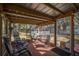 Enjoy the outdoors on this screened porch with comfortable seating at 3299 County Road 521, Wildwood, FL 34785